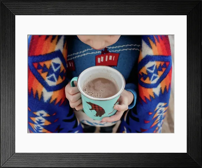 Framed Print : sky view of a boy wrapped in a blanket holding a hot chocolate outside Framed Print : sky view of a boy wrapped in a blanket holding a hot chocolate outside
