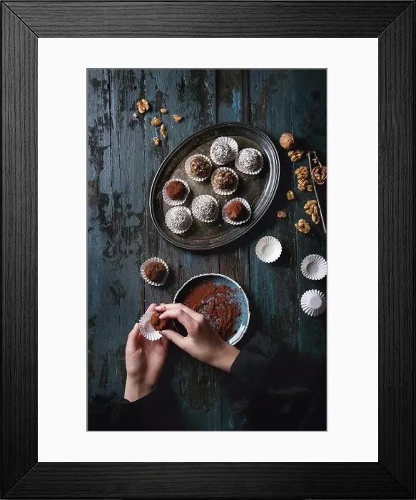 Framed Print : Child hands make homemade dark chocolate truffles with cocoa powder Framed Print : Child hands make homemade dark chocolate truffles with cocoa powder