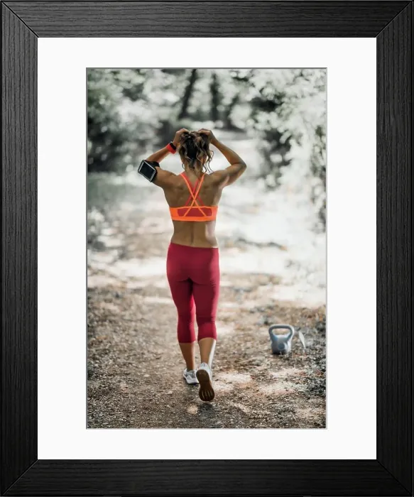 Framed Print : Outdoor exercising. Female athlete exercising in the park Framed Print : Outdoor exercising. Female athlete exercising in the park