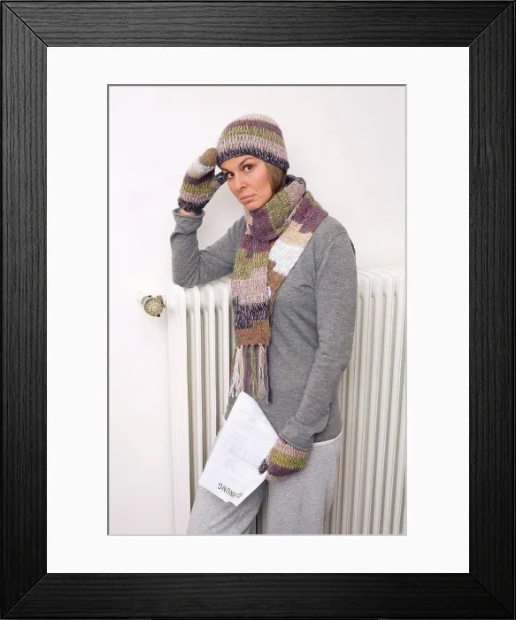 Framed Print : Woman holding utility bill, wearing scarf and cap Framed Print : Woman holding utility bill, wearing scarf and cap