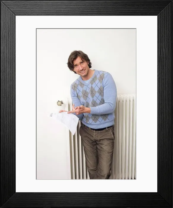 Framed Print : Man holding utility bill Framed Print : Man holding utility bill