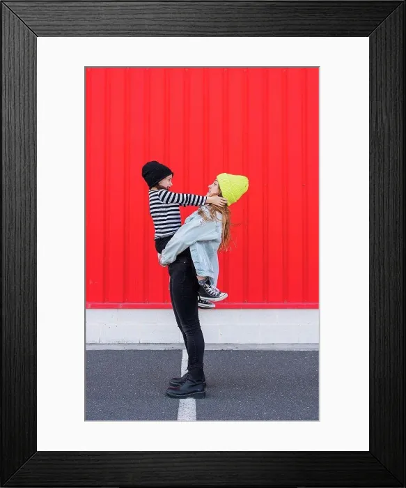 Framed Print : Teenage girl and younger sister having fun together Framed Print : Teenage girl and younger sister having fun together