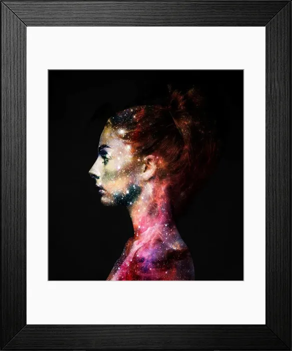 Framed Print : Intergalactic beauty. Profile of a young woman with the galaxy overlaid on her face Framed Print : Intergalactic beauty. Profile of a young woman with the galaxy overlaid on her face
