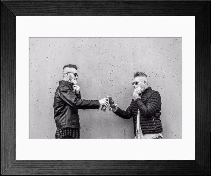 Framed Print : Guys friends toasting beer bottles with opened face masks - New normal lifestyle concept with people having fun Framed Print : Guys friends toasting beer bottles with opened face masks - New normal lifestyle concept with people having fun