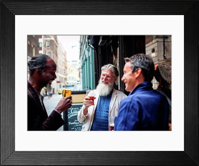 Framed Print : Three mature men, standing outside pub, holding beer glasses, laughing Framed Print : Three mature men, standing outside pub, holding beer glasses, laughing