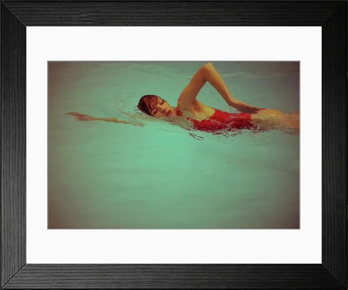 Framed Print : Woman swimming in pool Framed Print : Woman swimming in pool