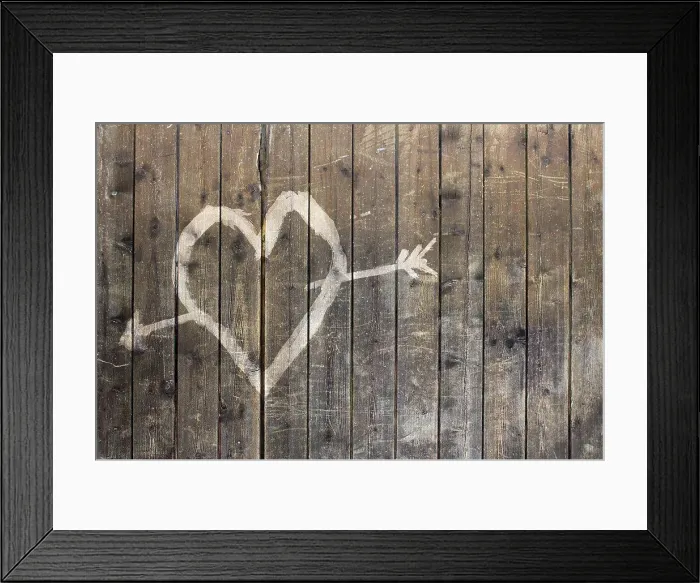 Framed Print : Heart shape with arrow symbol on wooden fence Framed Print : Heart shape with arrow symbol on wooden fence