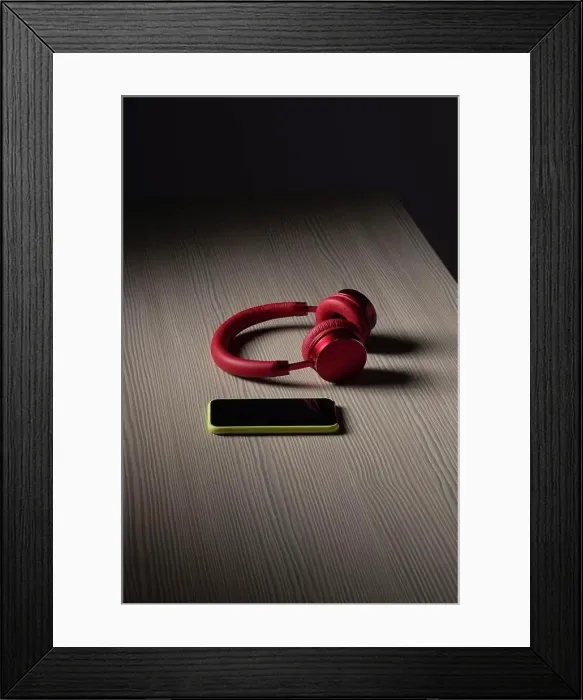 Framed Print : Headphones and smart phone on table Framed Print : Headphones and smart phone on table