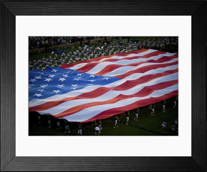 Framed Print : High angle view of a group of people holding a large American Flag Framed Print : High angle view of a group of people holding a large American Flag