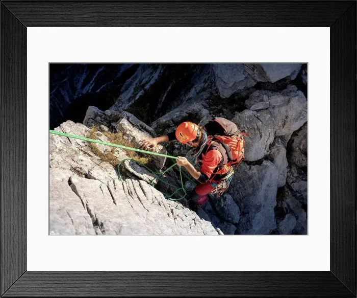 Framed Print : Determinant male Hiker moving down from mountain with rope on sunny day Framed Print : Determinant male Hiker moving down from mountain with rope on sunny day
