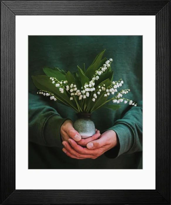 Framed Print : Close up of hands holding a small vase of lily of the valley flowers Framed Print : Close up of hands holding a small vase of lily of the valley flowers