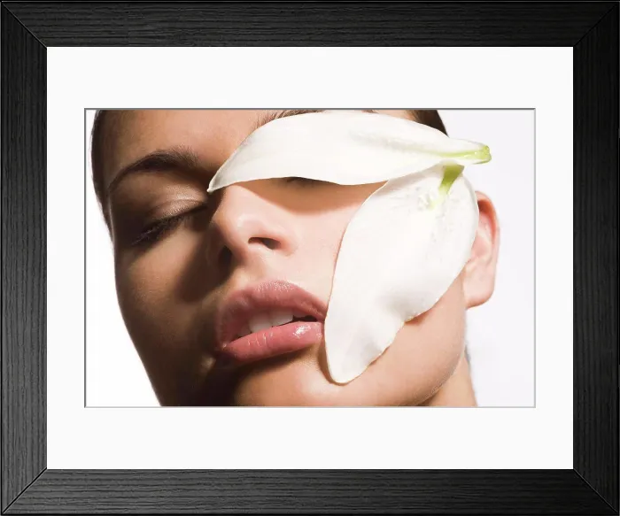 Framed Print : close-up of woman face with flower patals Framed Print : close-up of woman face with flower patals