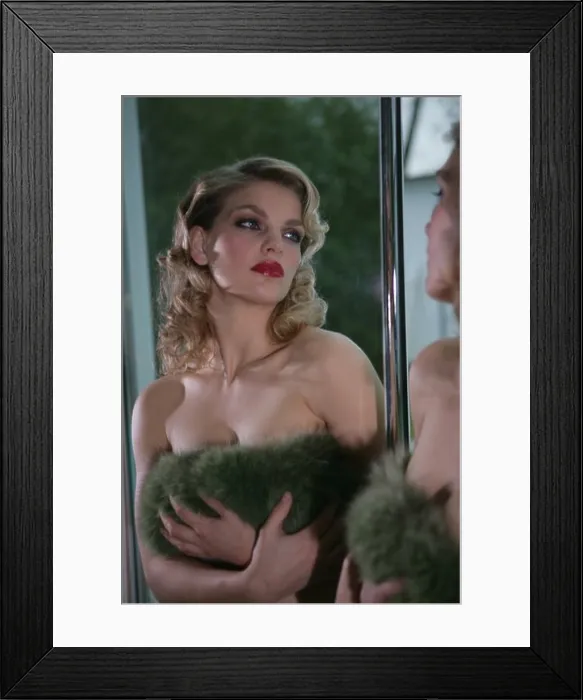 Framed Print : Woman admiring herself in mirror
