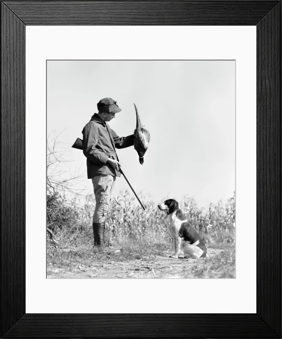 Framed Print : 1940s YOUNG MAN HUNTER WITH SHOTGUN AND HUNTING DOG HOLDING BIRD PHEASANT Framed Print : 1940s YOUNG MAN HUNTER WITH SHOTGUN AND HUNTING DOG HOLDING BIRD PHEASANT