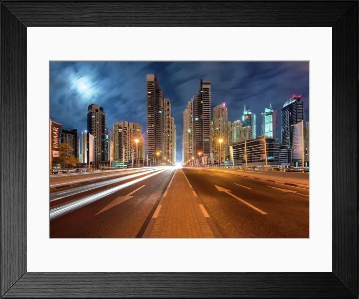 Framed Print : Cityscape with illuminated skyscrapers in Dubai, United Arab Emirates at dusk, highway in foreground Framed Print : Cityscape with illuminated skyscrapers in Dubai, United Arab Emirates at dusk, highway in foreground