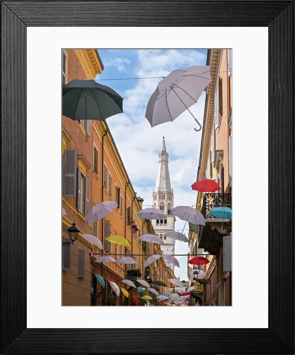 Framed Print : Multicolored umbrellas hanging in a narrow street in the center of Modena Framed Print : Multicolored umbrellas hanging in a narrow street in the center of Modena