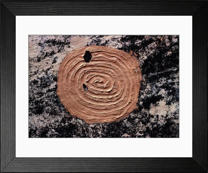 Framed Print : Ancient Ancestral Pueblo mud spiral pictograph on black soot-covered wall of ruin