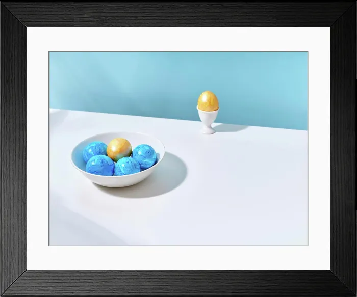 Framed Print : Blue and yellow Easter eggs in a bowl and in an egg cup Framed Print : Blue and yellow Easter eggs in a bowl and in an egg cup