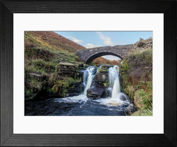 Framed Print : The River Dane flows under the packhorse bridge at Three Shires Head where the counties of Cheshire