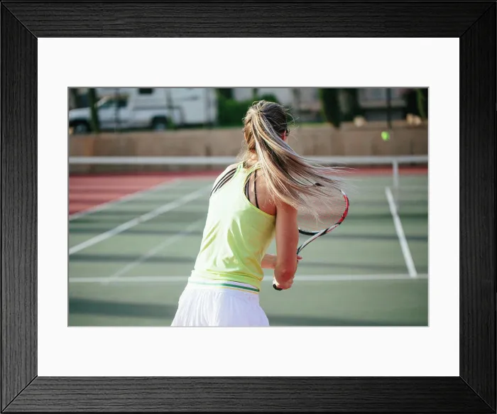 Framed Print : Motion shot of blonde athlete with long pony tail being active d Framed Print : Motion shot of blonde athlete with long pony tail being active d