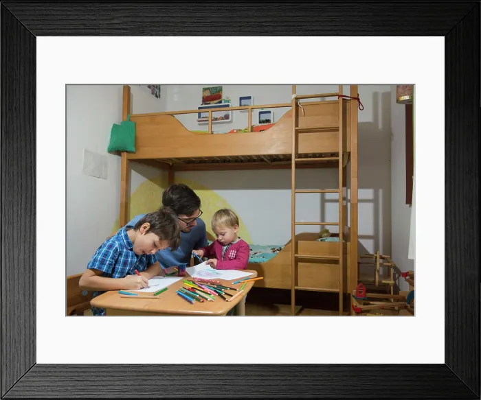 Framed Print : Brothers colouring with coloured pencils while father is assisting them, Munich, Germany Framed Print : Brothers colouring with coloured pencils while father is assisting them, Munich, Germany
