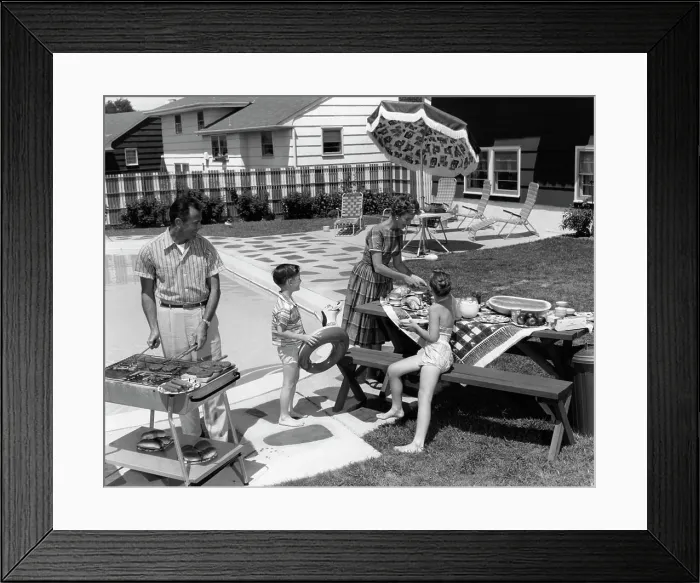 Framed Print : 1960S Family Of 4 In Backyard At Poolside Father Barbecuing & Mother & Children Making Preparations At Picnic Table Framed Print : 1960S Family Of 4 In Backyard At Poolside Father Barbecuing & Mother & Children Making Preparations At Picnic Table