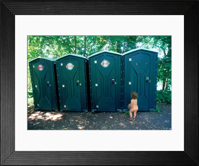 Framed Print : Yound child waiting naked outside line of outhouses or portable toilets at Stockholm city beach park in summer Framed Print : Yound child waiting naked outside line of outhouses or portable toilets at Stockholm city beach park in summer