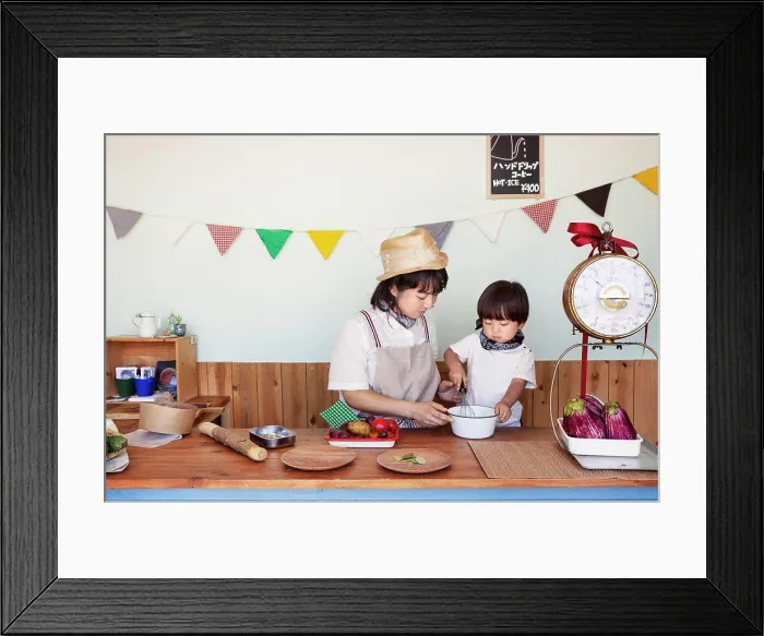 Framed Print : Japanese woman and boy standing in a farm shop, preparing food Framed Print : Japanese woman and boy standing in a farm shop, preparing food