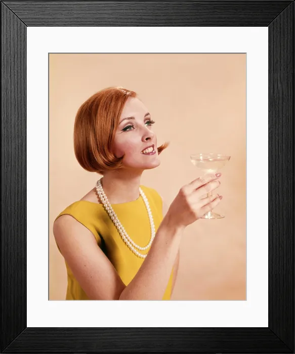 Framed Print : 1960s FASHIONABLE RED HEADED WOMAN TOASTING HOLDING GLASS OF CHAMPAGNE Framed Print : 1960s FASHIONABLE RED HEADED WOMAN TOASTING HOLDING GLASS OF CHAMPAGNE