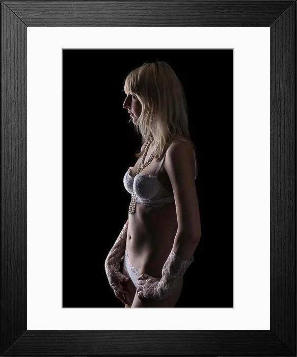 Framed Print : Young woman wearing white lingerie and lace gloves, with a pearl necklace around her neck Framed Print : Young woman wearing white lingerie and lace gloves, with a pearl necklace around her neck