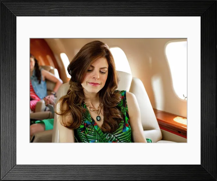 Framed Print : mom in foreground reading magazine with family In cabin of private plane traveling for family vacation Framed Print : mom in foreground reading magazine with family In cabin of private plane traveling for family vacation