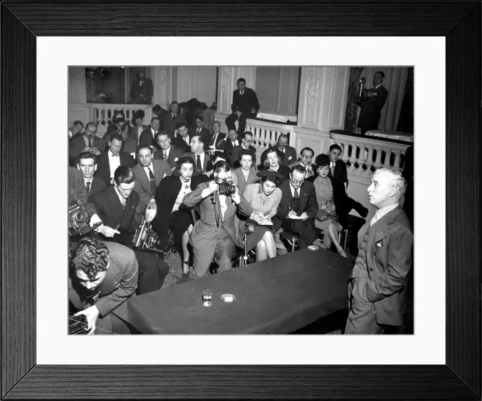 Framed Print : Chaplin Talks - Reporters and cameramen crowd the floor of the hotel ballroom and are draped over the balcony Framed Print : Chaplin Talks - Reporters and cameramen crowd the floor of the hotel ballroom and are draped over the balcony