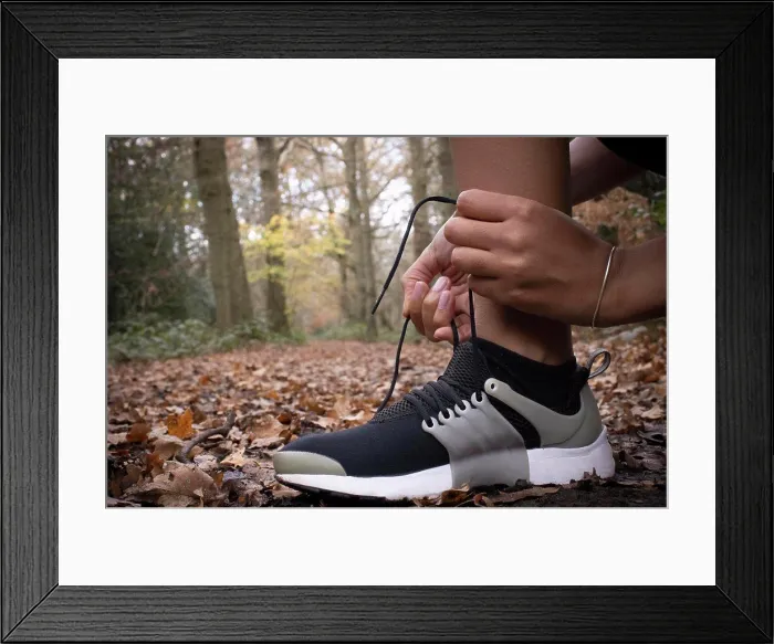 Framed Print : Close up female runner tying shoelace in autumn woods Framed Print : Close up female runner tying shoelace in autumn woods