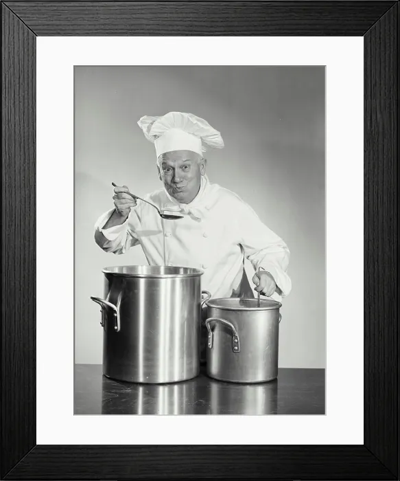 Framed Print : Vintage photograph. man in chef uniform cooking in pot Framed Print : Vintage photograph. man in chef uniform cooking in pot