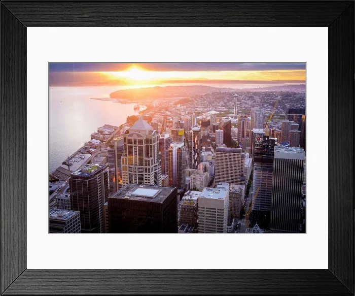 Framed Print : Seattle Skyline At Sunset With Sun Peaking Through The Clouds Framed Print : Seattle Skyline At Sunset With Sun Peaking Through The Clouds