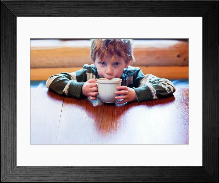 Framed Print : Caucasian boy drinking hot chocolate Framed Print : Caucasian boy drinking hot chocolate