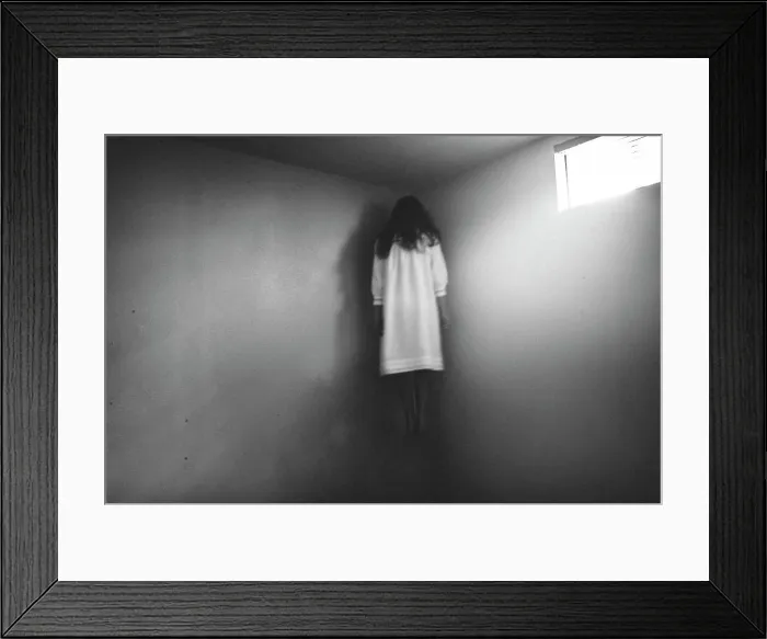 Framed Print : Scary girl in nightgown hovering in the corner of room Framed Print : Scary girl in nightgown hovering in the corner of room