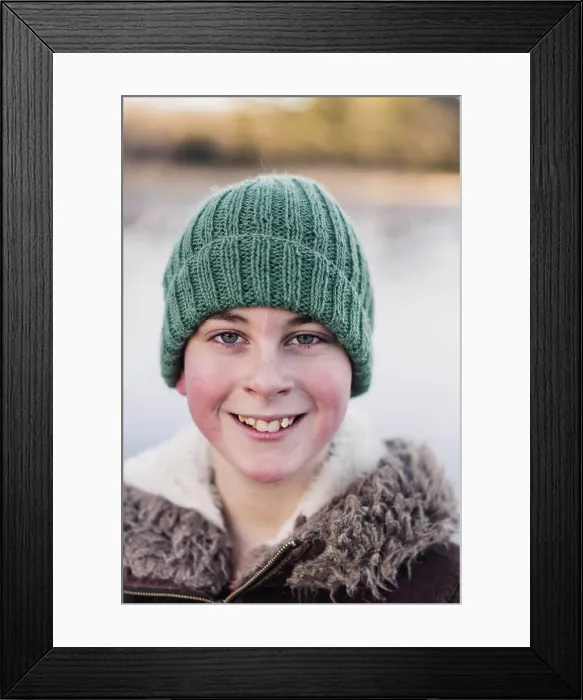 Framed Print : winter portrait of smiling 10 year old boy with a woolly hat Framed Print : winter portrait of smiling 10 year old boy with a woolly hat