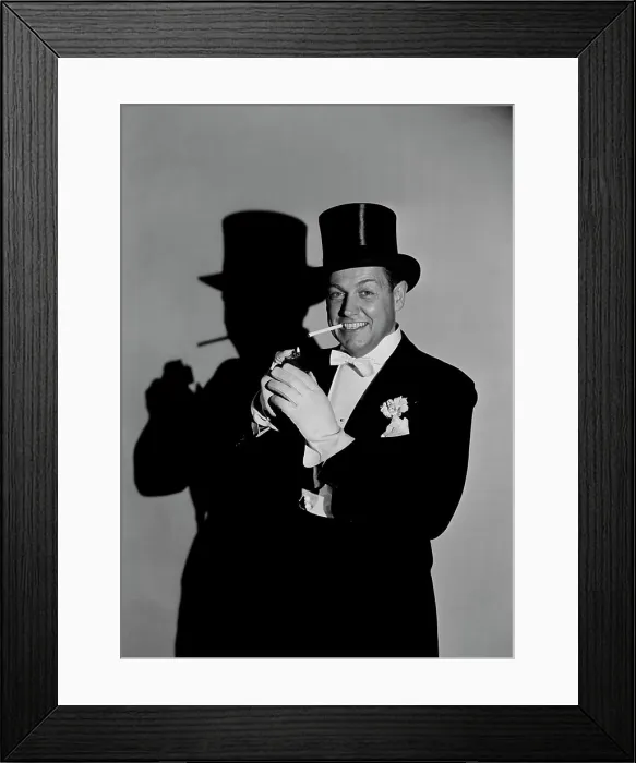 Framed Print : Studio portrait of man wearing tophat, smoking Framed Print : Studio portrait of man wearing tophat, smoking