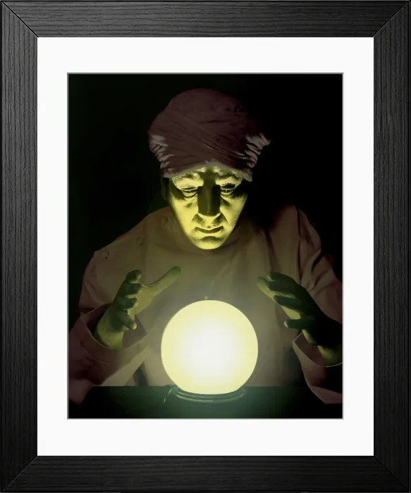 Framed Print : Close-up of a fortune teller looking into a crystal ball