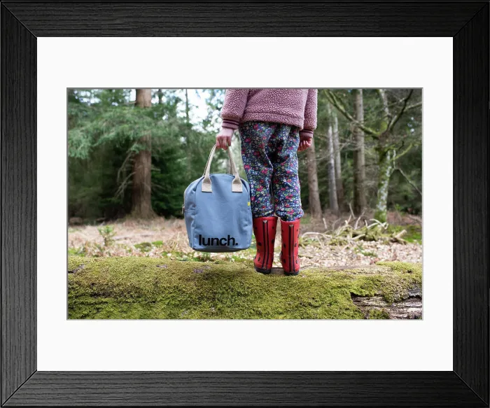 Framed Print : child holding onto a picnic lunch bag whilst walking in the forest Framed Print : child holding onto a picnic lunch bag whilst walking in the forest
