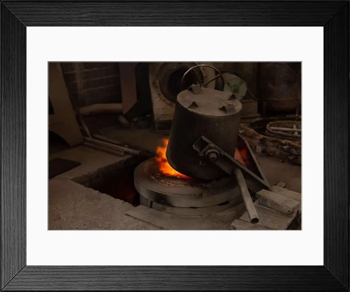 Framed Print : flask heating on furnace in foundry