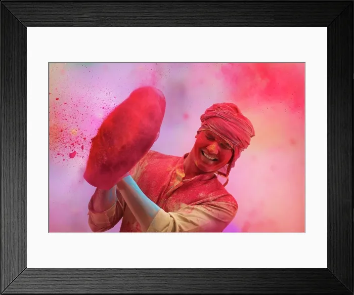 Framed Print : A YOUNG MAN STANDING AND CHEERFULLY PLAYING HOLI Framed Print : A YOUNG MAN STANDING AND CHEERFULLY PLAYING HOLI