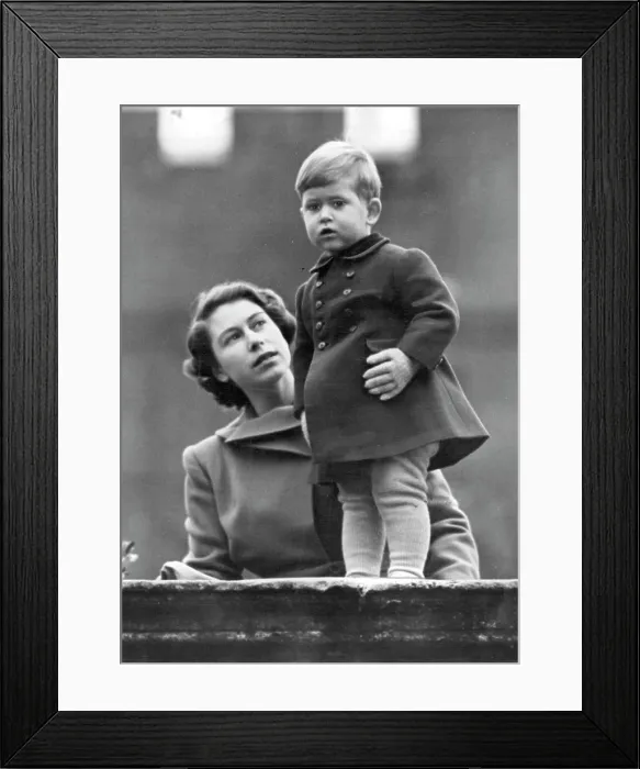 Framed Print : The Princess Watches As Queen Juliana Visits The City -- Warmly wrapped little Prince Charles Framed Print : The Princess Watches As Queen Juliana Visits The City -- Warmly wrapped little Prince Charles