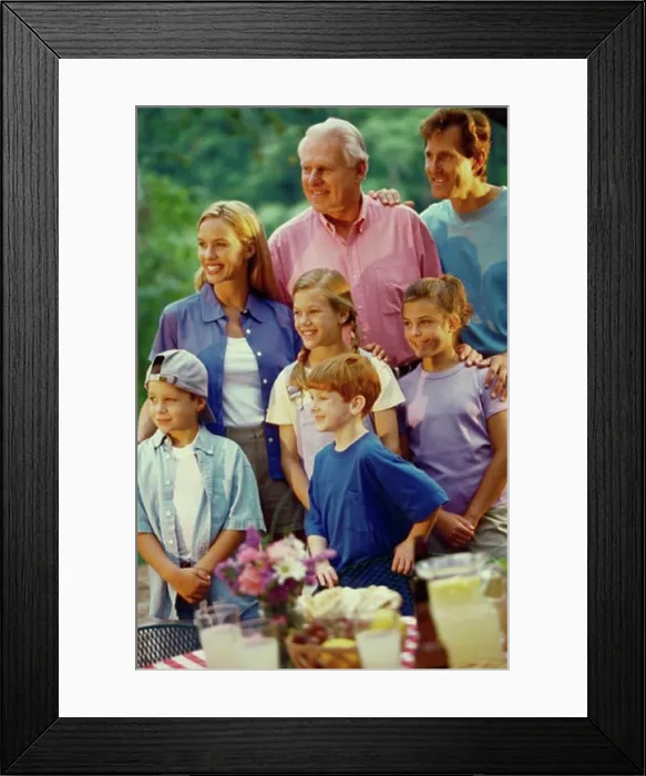 Framed Print : Close-up of a three generation family smiling Framed Print : Close-up of a three generation family smiling