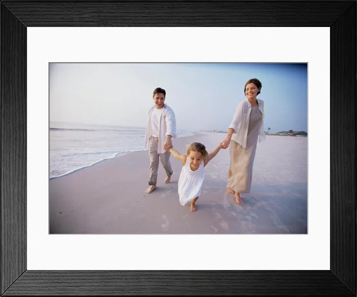 Framed Print : Couple with their daughter on the beach Framed Print : Couple with their daughter on the beach