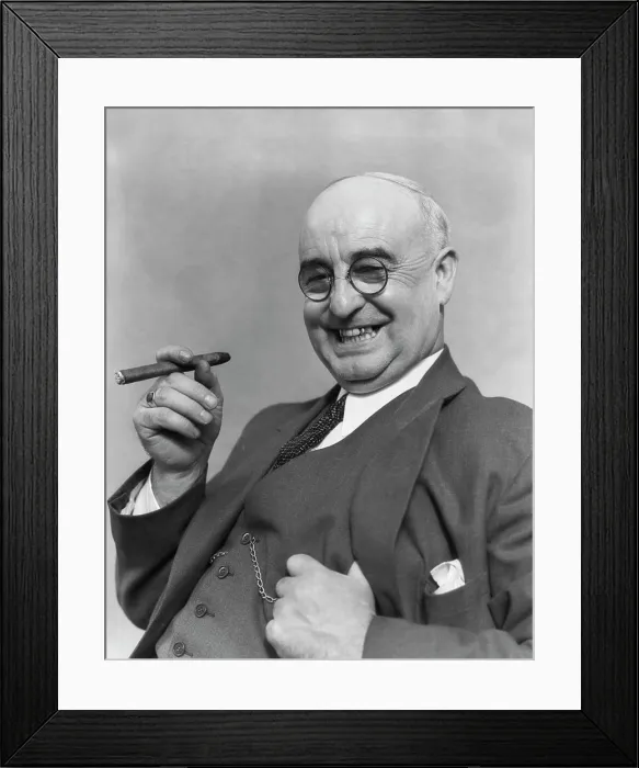 Framed Print : 1930S Elderly Businessman In 3-Piece Suit & Glasses Leaning Back Smiling With Cigar In Hand Framed Print : 1930S Elderly Businessman In 3-Piece Suit & Glasses Leaning Back Smiling With Cigar In Hand