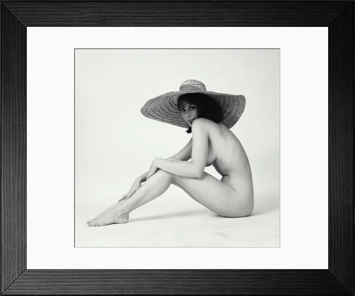 Framed Print : Portrait of a nude young woman wearing a sunhat