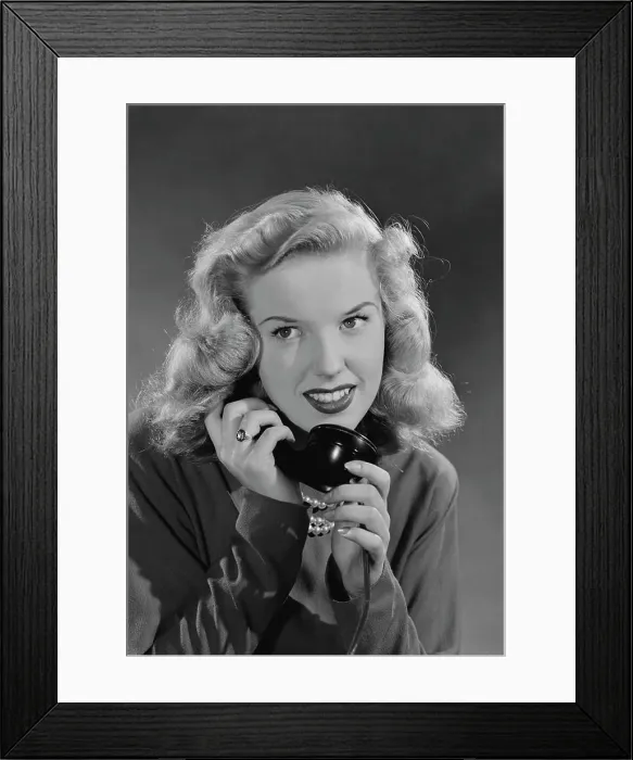 Framed Print : Portrait of woman talking on phone