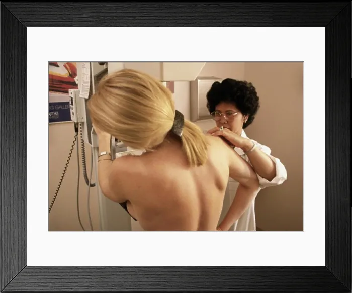 Framed Print : Female doctor preparing a patient for a mammogram Framed Print : Female doctor preparing a patient for a mammogram